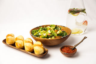 Wood tray with three breads on top